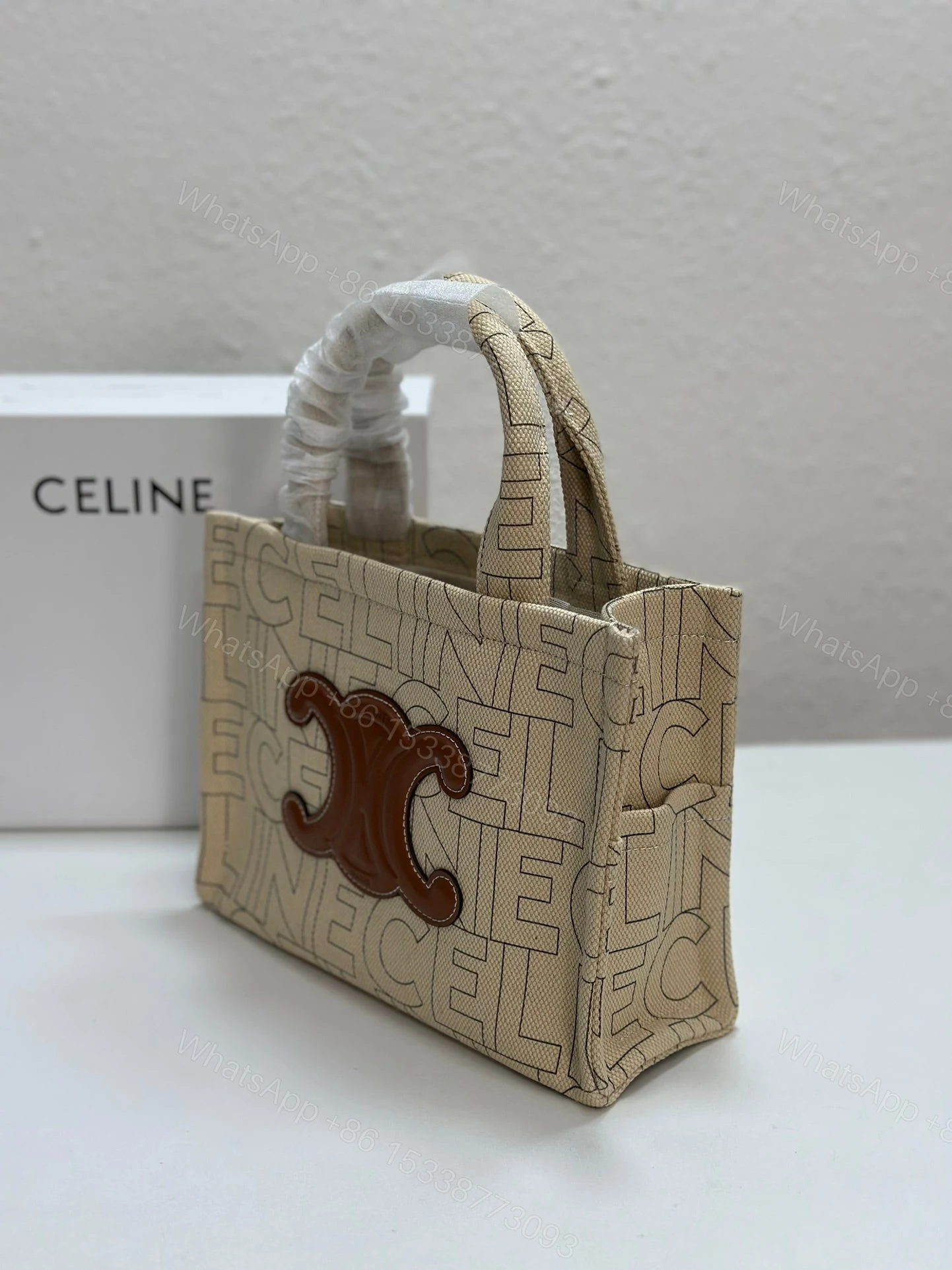 View 3 of CELINE SMALL CABAS THAIS IN TEXTILE WITH ALL-OVER PRINT NATURAL TAN 25CM