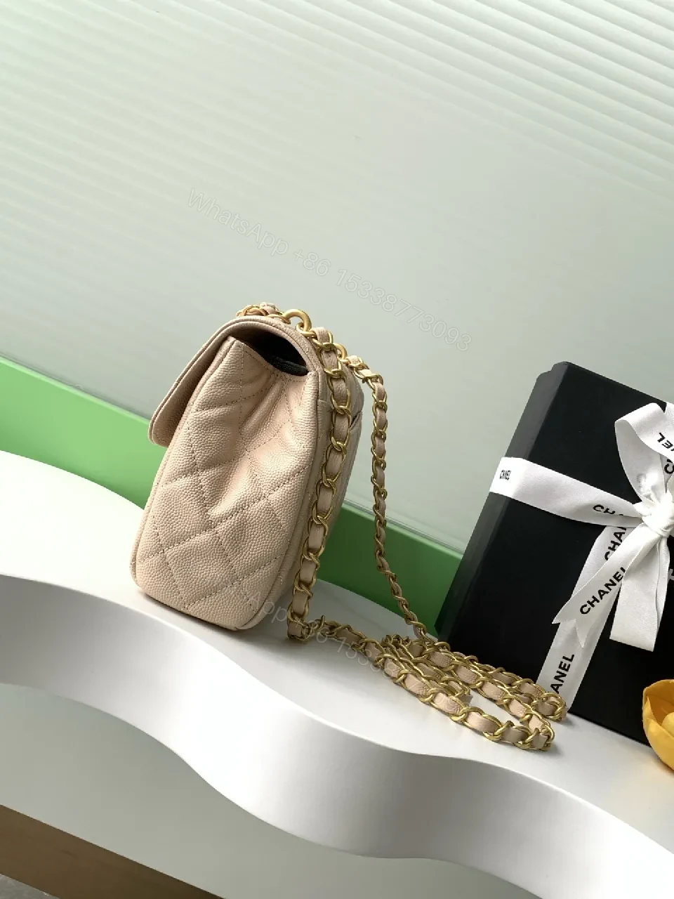 View 2 of Soft Beige Quilted Bag with Luxe Chain – Compact Luxury Tote