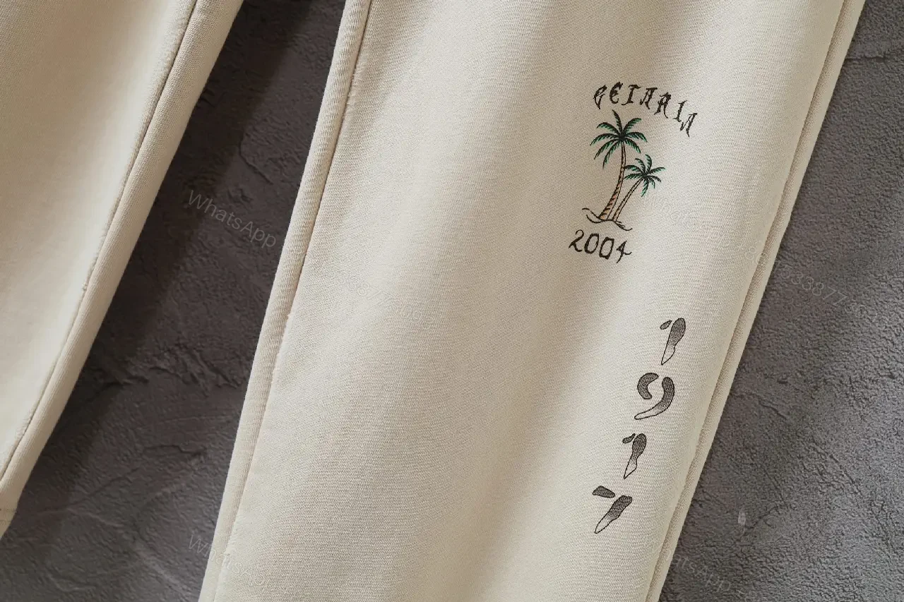 View 3 of Beige Wide-Leg Pants with Drawstring and Embroidered Patches