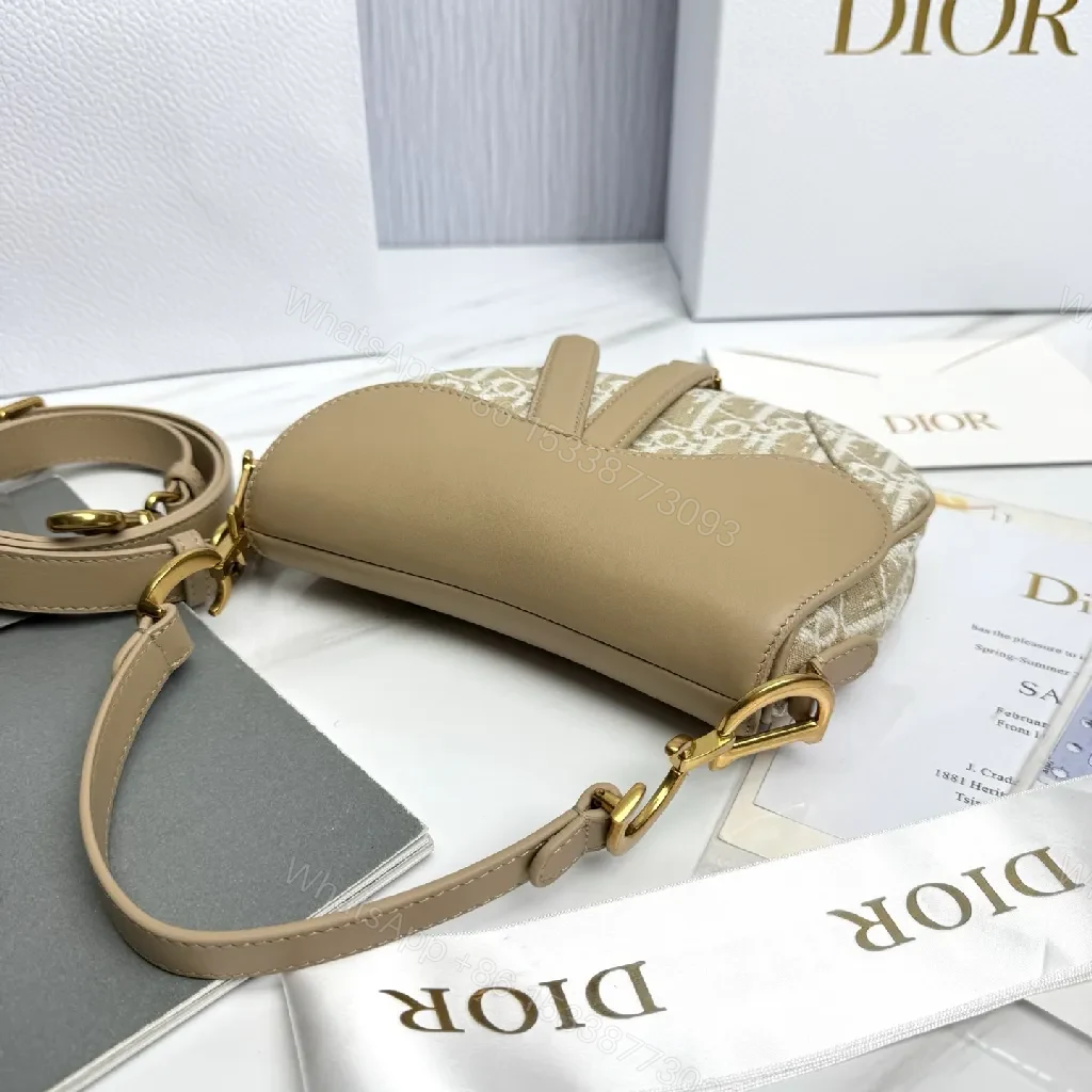 View 7 of Beige Leather-Trim Mini Saddle Bag, Monogram Canvas, Crossbody