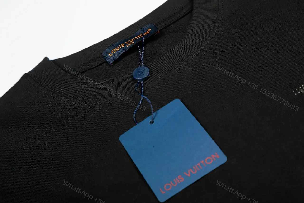 View 2 of Minimalist Black Cotton Tee with Subtle Monogram Detail - Everyday Luxury
