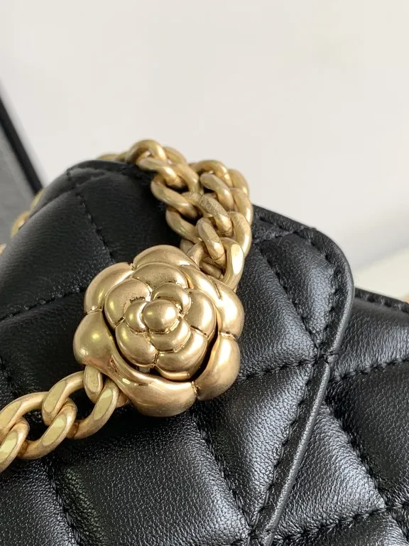 View 4 of Mini Quilted Black Chain Bag with Gold Logo â€” Luxury Silhouette
