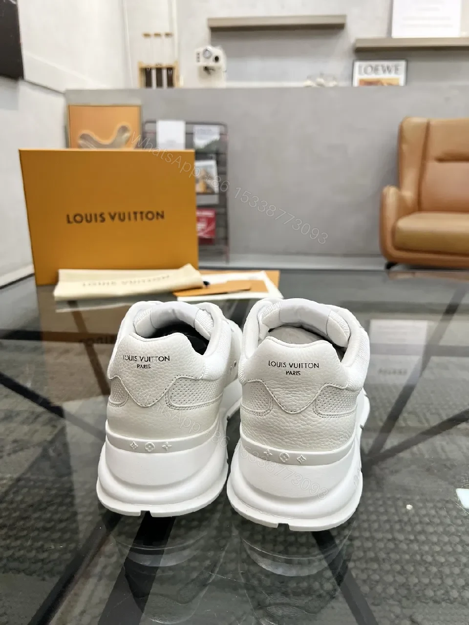 View 7 of White Leather Low-Top Luxury Sneakers with Subtle Logo Detail