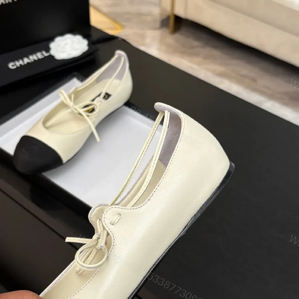 View 3 of Ivory Leather Ballet Flats with Black Cap Toe, Lace-Up, Elegant