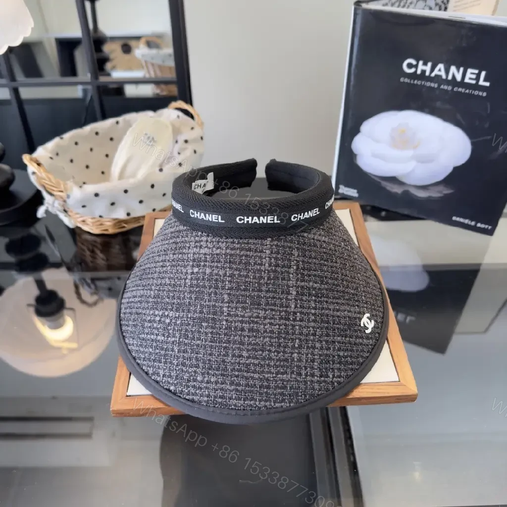View 9 of Dark Gray Tweed Visor Cap with White Chanel Logo and Silver Emblem