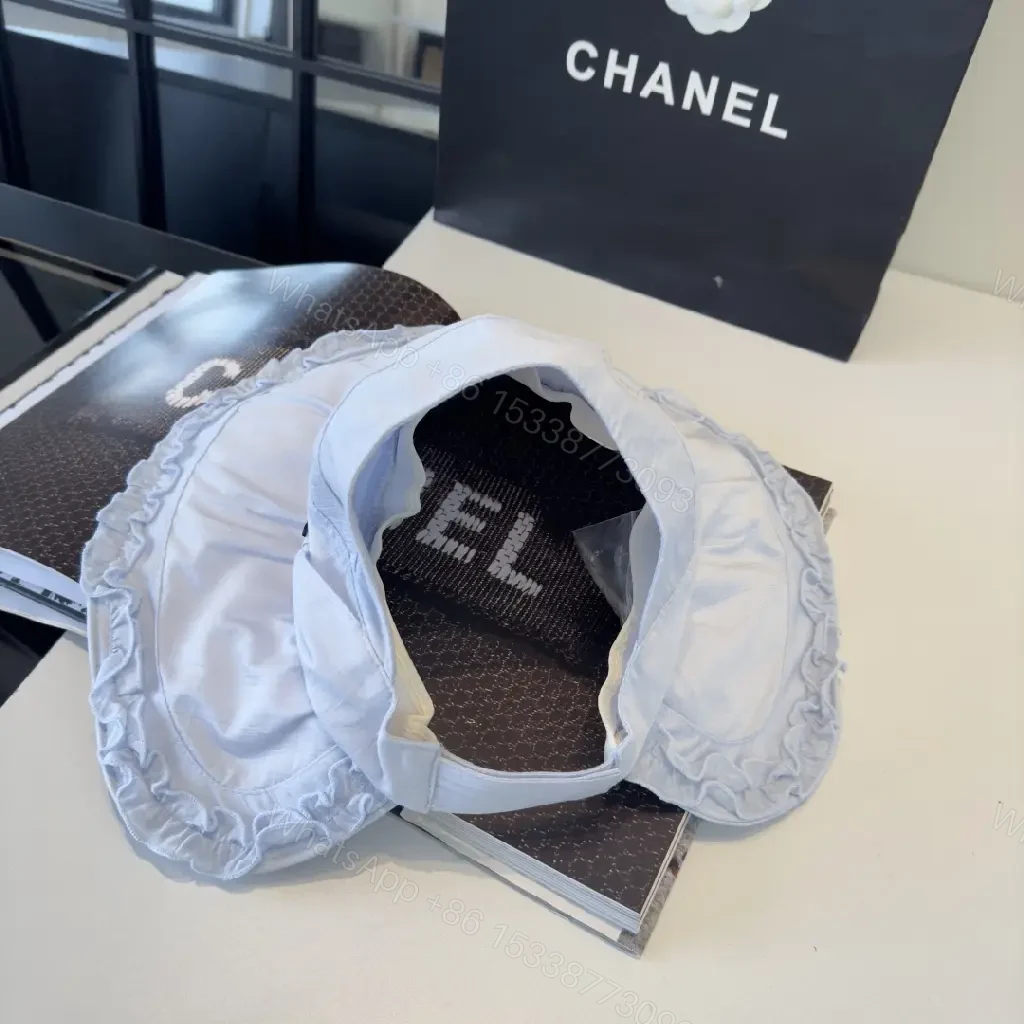 View 8 of Pastel Blue Floppy Hat with Ruffled Brim & Chanel Charm