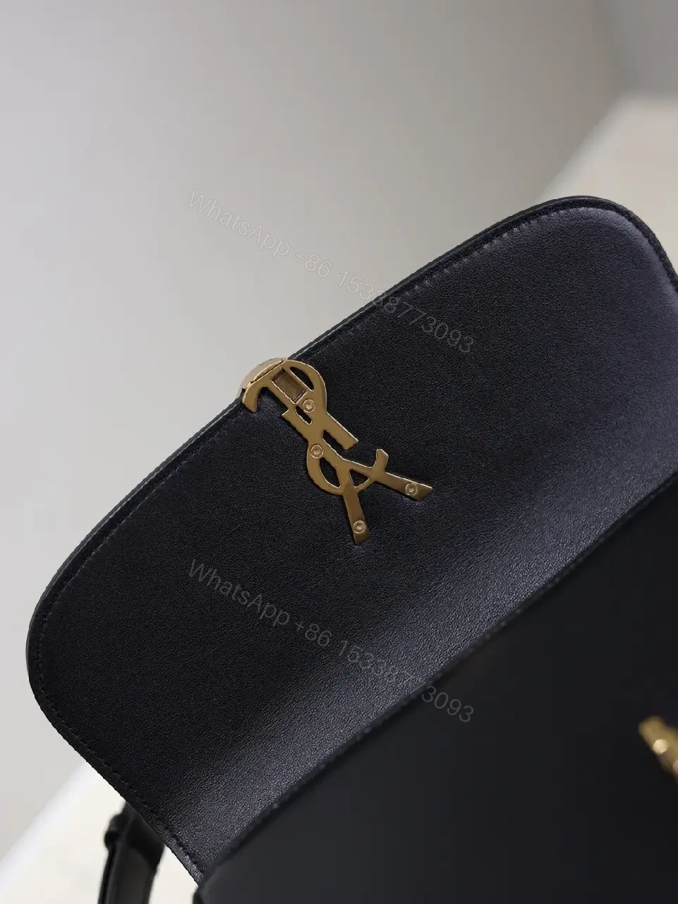 View 4 of Compact Black Leather Shoulder Bag with Gold Hardware