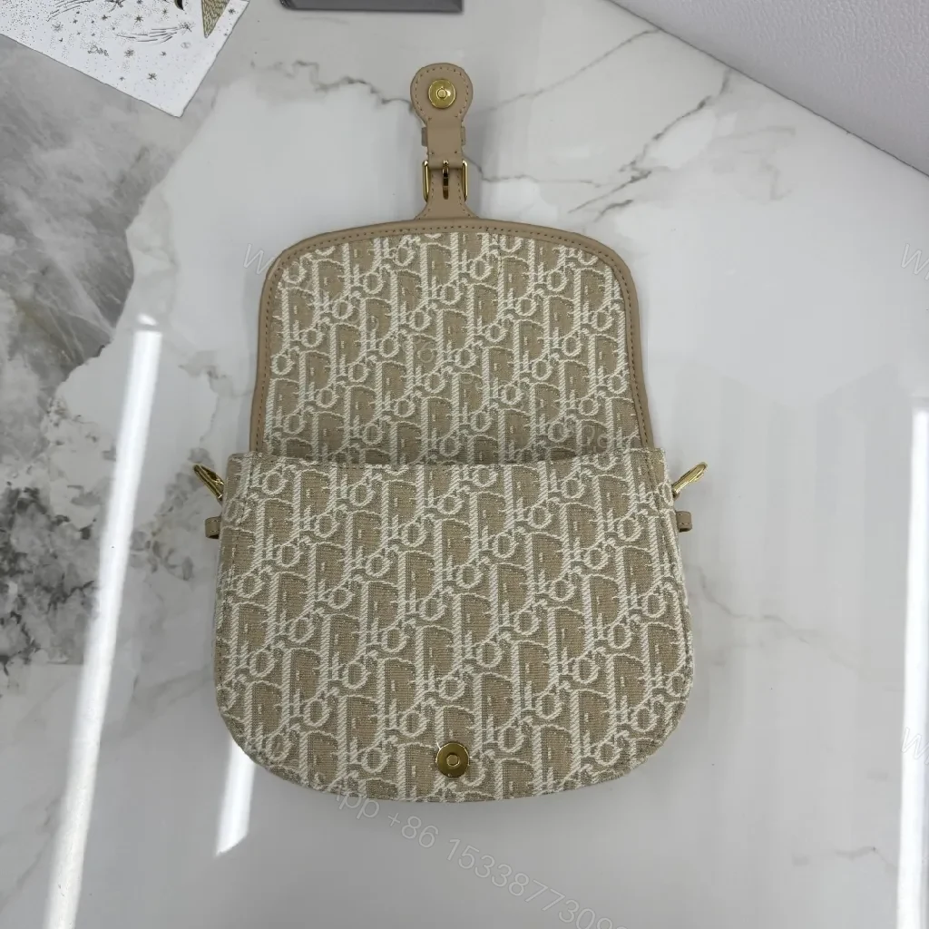 View 2 of Beige Monogram-Textured Leather Mini Shoulder Bag