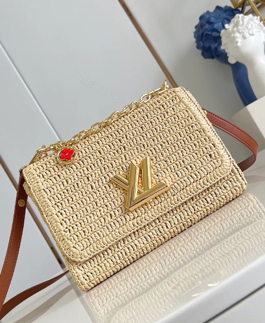 Elegant Woven Straw Shoulder Bag with Gold Hardware — view 1