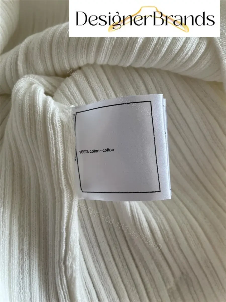 View 8 of White Knit Tee with Logo Embellishment – Elevated Texture, Modern Luxury
