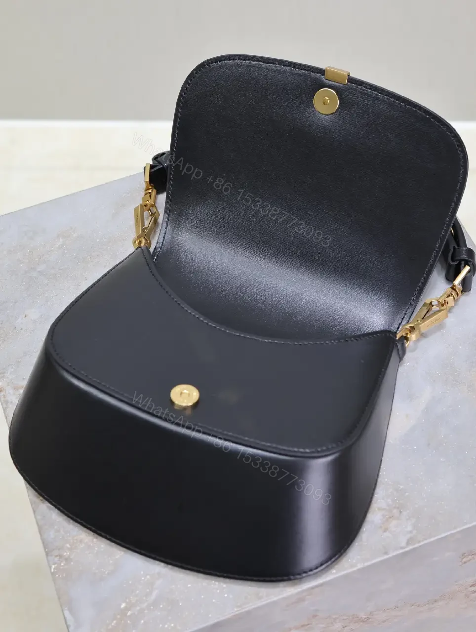 View 3 of Structured Leather Crossbody with Gold Emblem, Compact & Versatile Bag