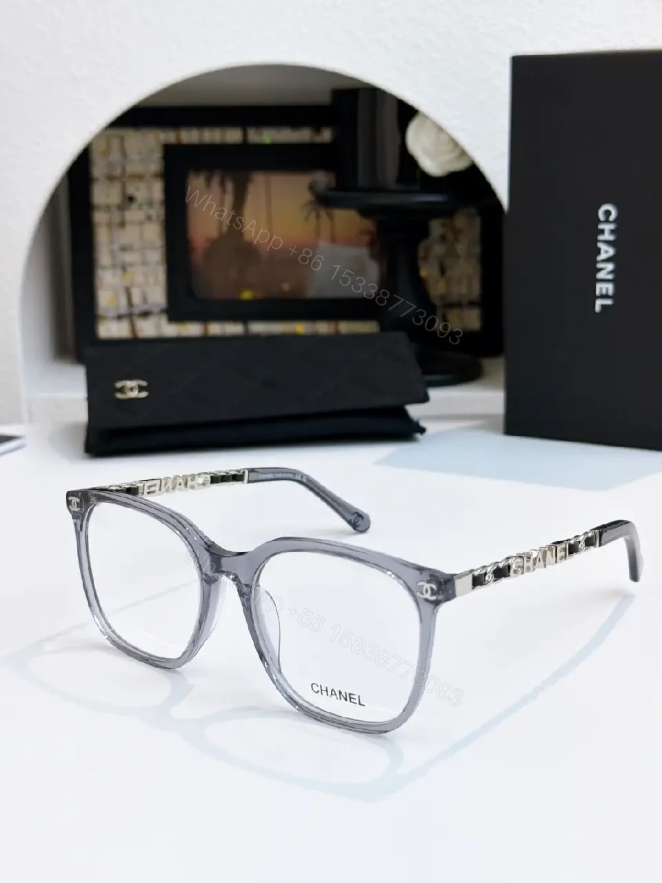 View 2 of Clear Translucent Frame Modern Oversized Sunglasses with CHANEL Accents