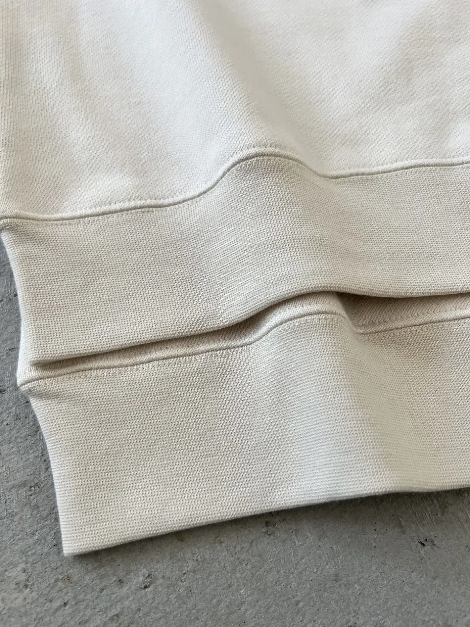 View 2 of Bold Contrast Crest Sweatshirt - Cream Body, Black Sleeves, Luxe Comfort