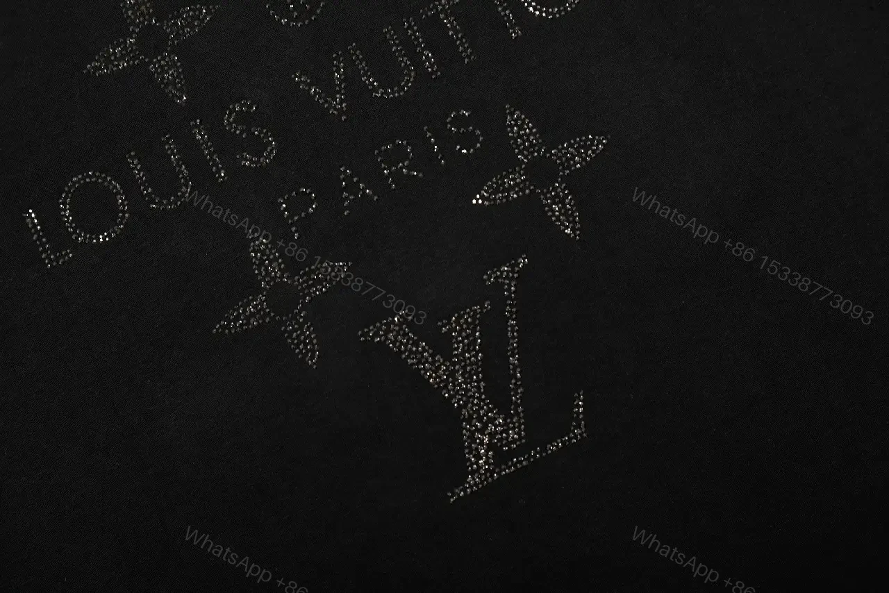 View 3 of Minimalist Black Cotton Tee with Subtle Monogram Detail - Everyday Luxury