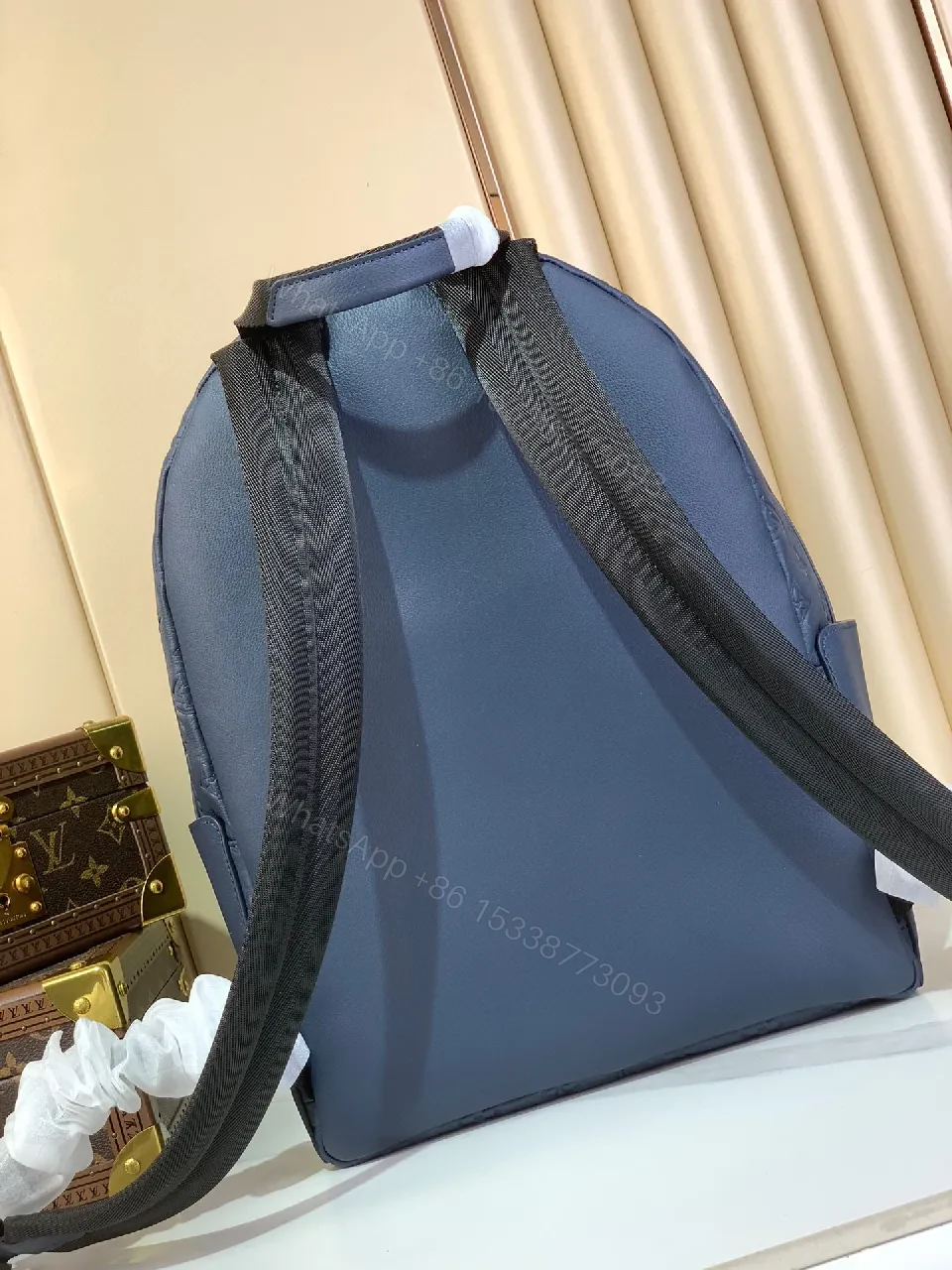 View 3 of Compact Monogram Backpack: Textured Luxury, Everyday-Ready