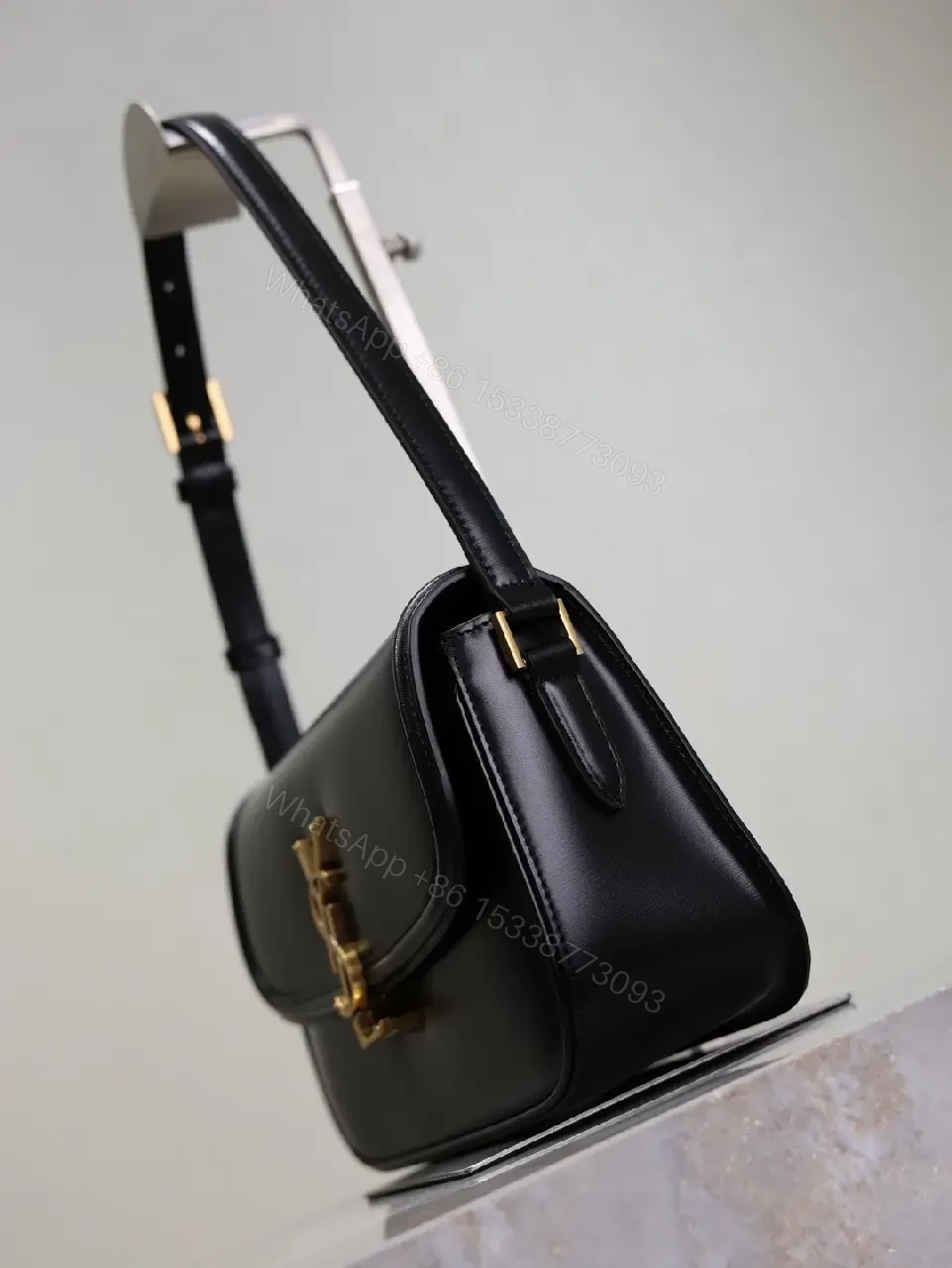 View 6 of Compact Black Leather Shoulder Bag with Gold Hardware