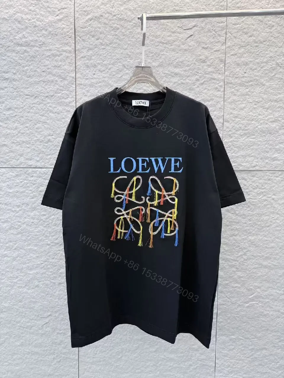 View 4 of Bold Embellished Tee: Black Cotton, Relaxed Fit, Multicolor Embroidery
