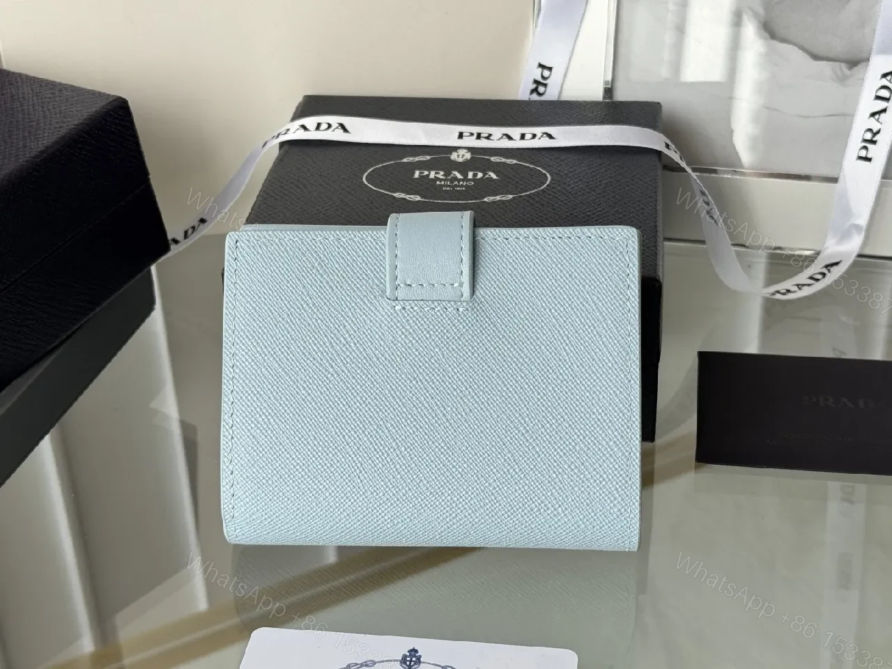 View 3 of Blue Saffiano-Like Bifold Wallet with Triangle Closure, Minimal Luxury