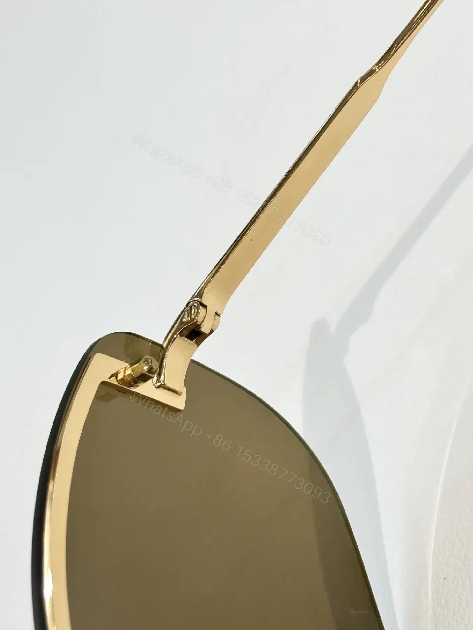 View 4 of Bold Rimless Sunglasses with Gold Hardware