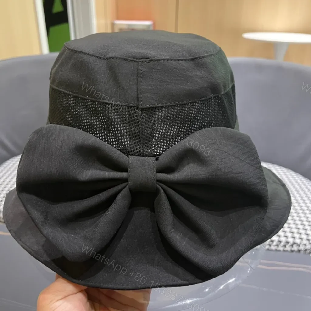 View 12 of Minimalist Black Bucket Hat with Discreet Luxe Label