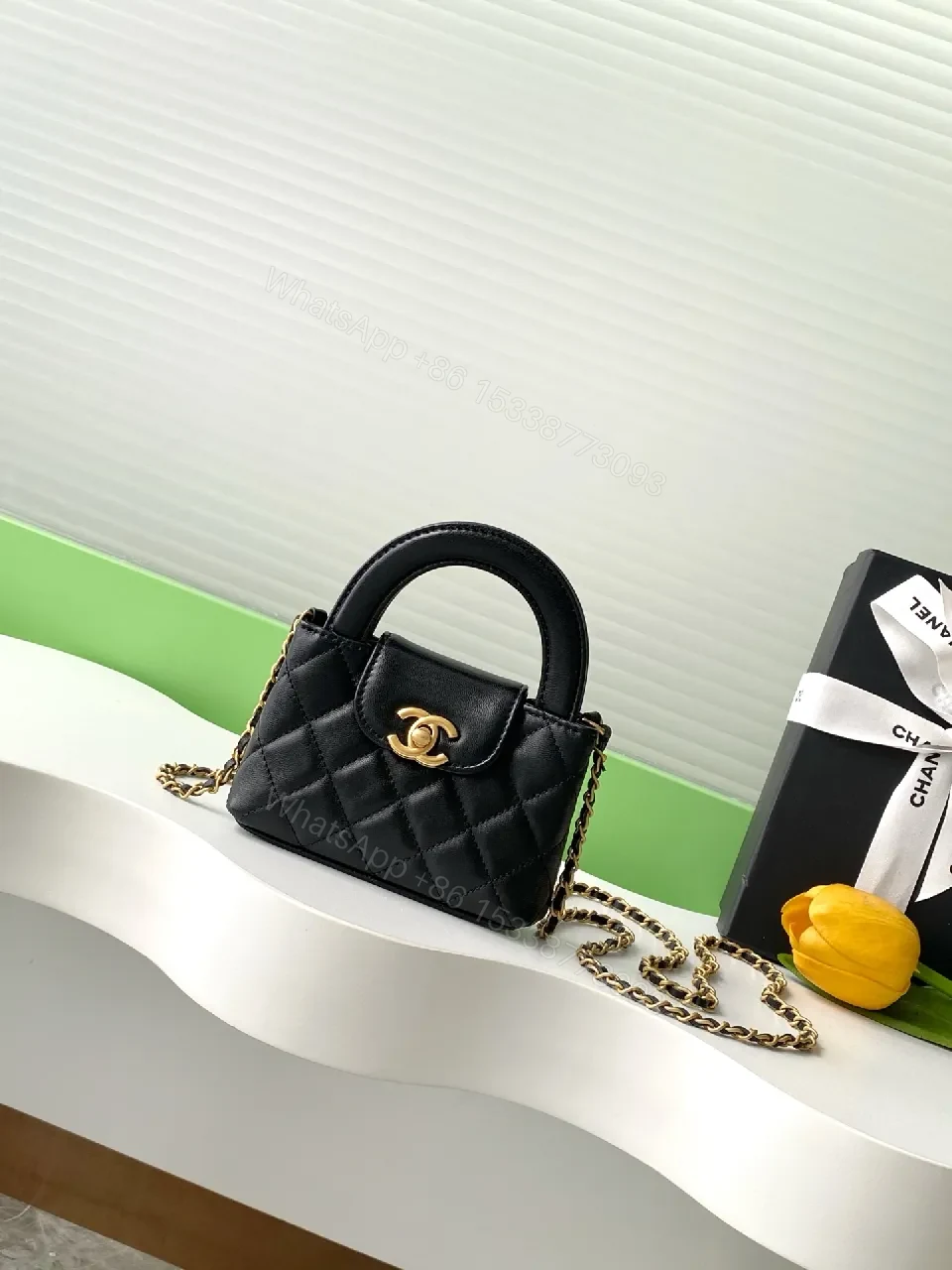 Black Quilted Mini Handbag with Gold Hardware, Chain Strap — view 1