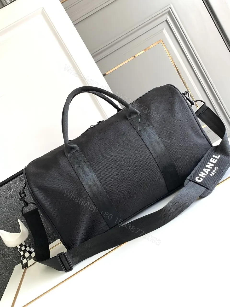 View 7 of Structured Black Travel Bag: Matte, Signature Emblem, All-Day Ready
