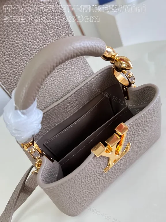 View 4 of Taupe Pebbled Leather Crossbody: Gold LV Accent, Compact Luxury Bag