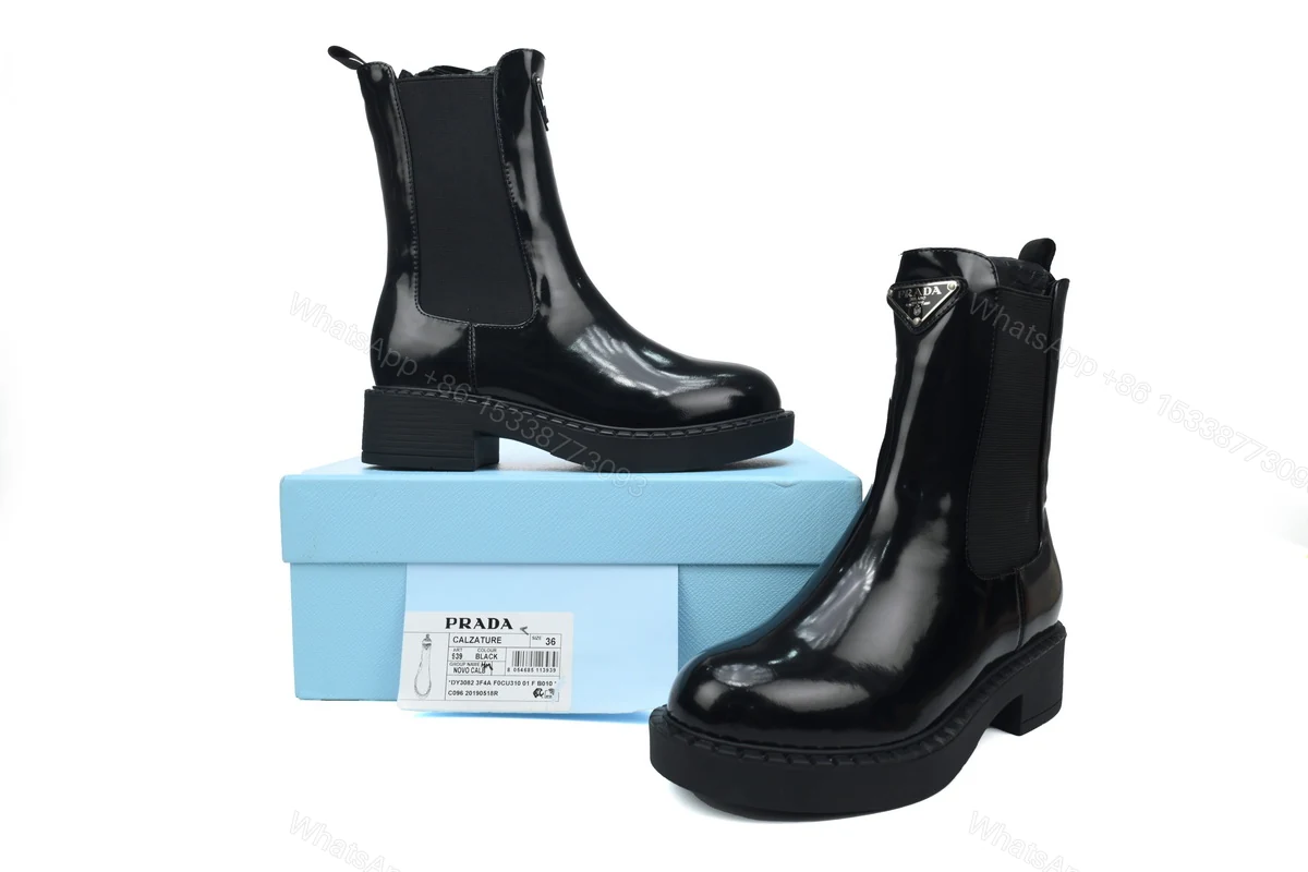 View 2 of Prada Monolith patent leather booties black