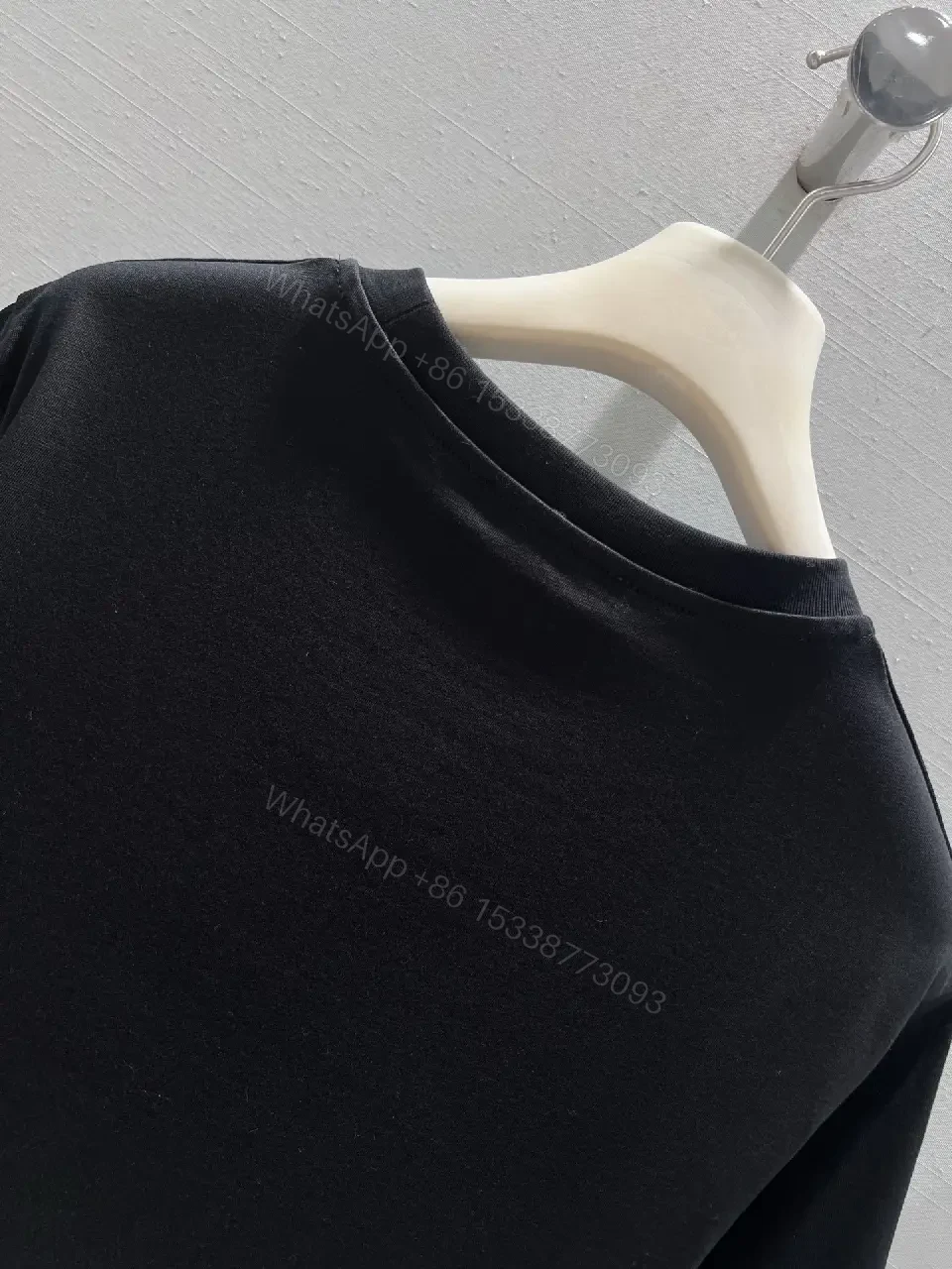 View 10 of Black Cotton Tee with Subtle Embroidered Logo - Luxury Everyday Wear