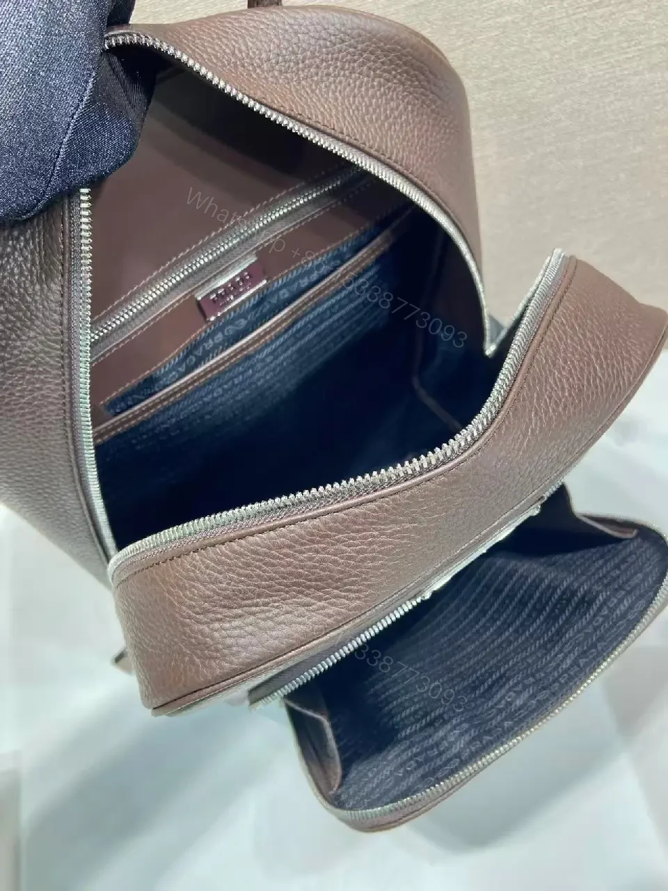 View 9 of Structured Luxury Leather Backpack: Modern Texture, Practical Detailing