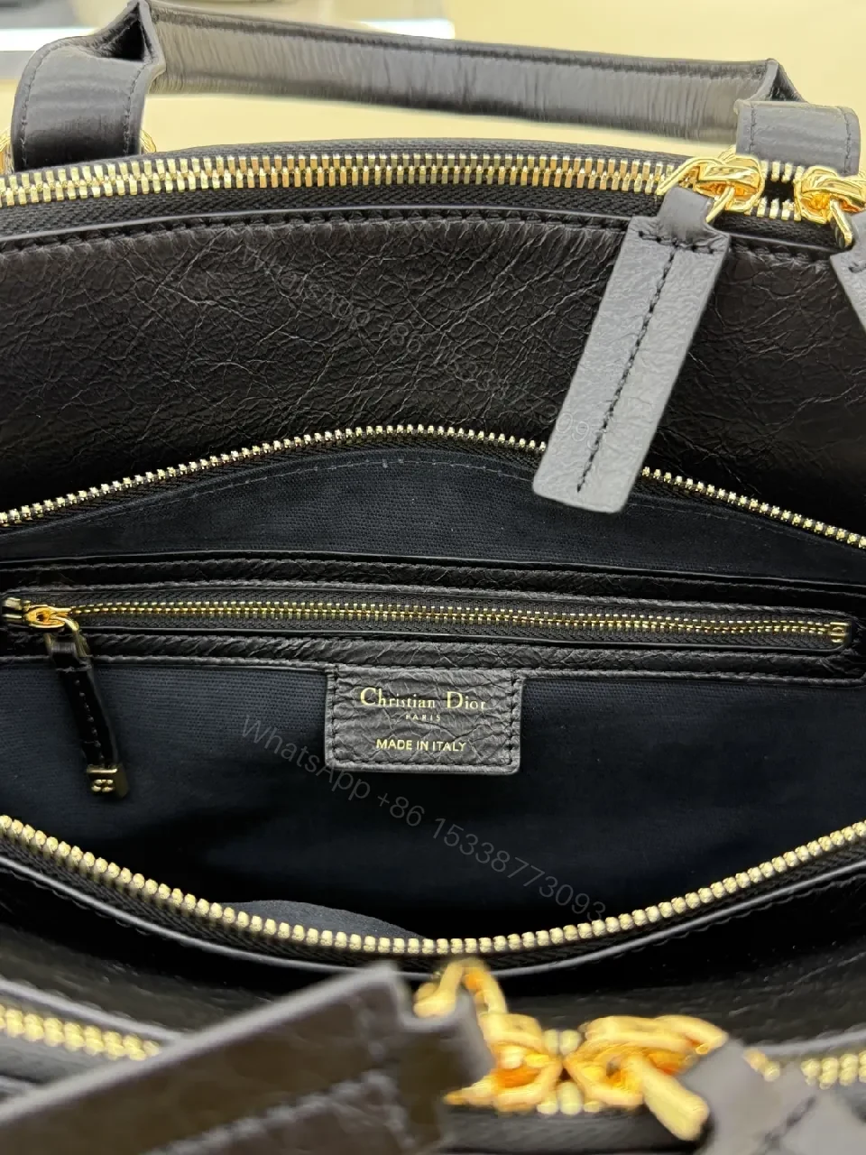 View 6 of Compact Luxury Satchel: Black Leather, Gold Hardware, Structured Style