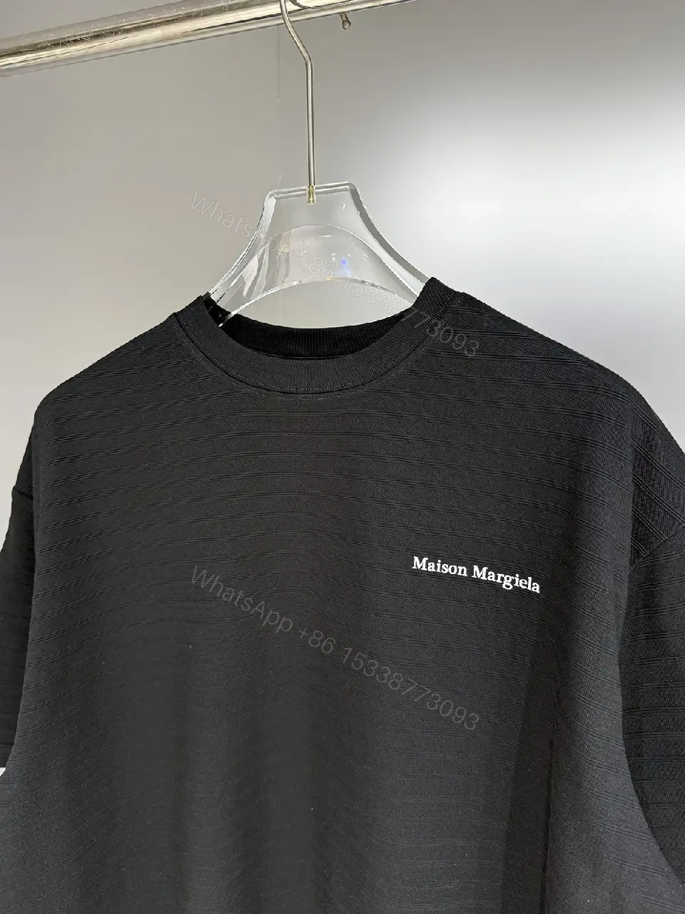 View 6 of Black Cotton Crewneck Tee + Minimalist Style + Subtle Logo + All-Day Comfort + T-Shirt