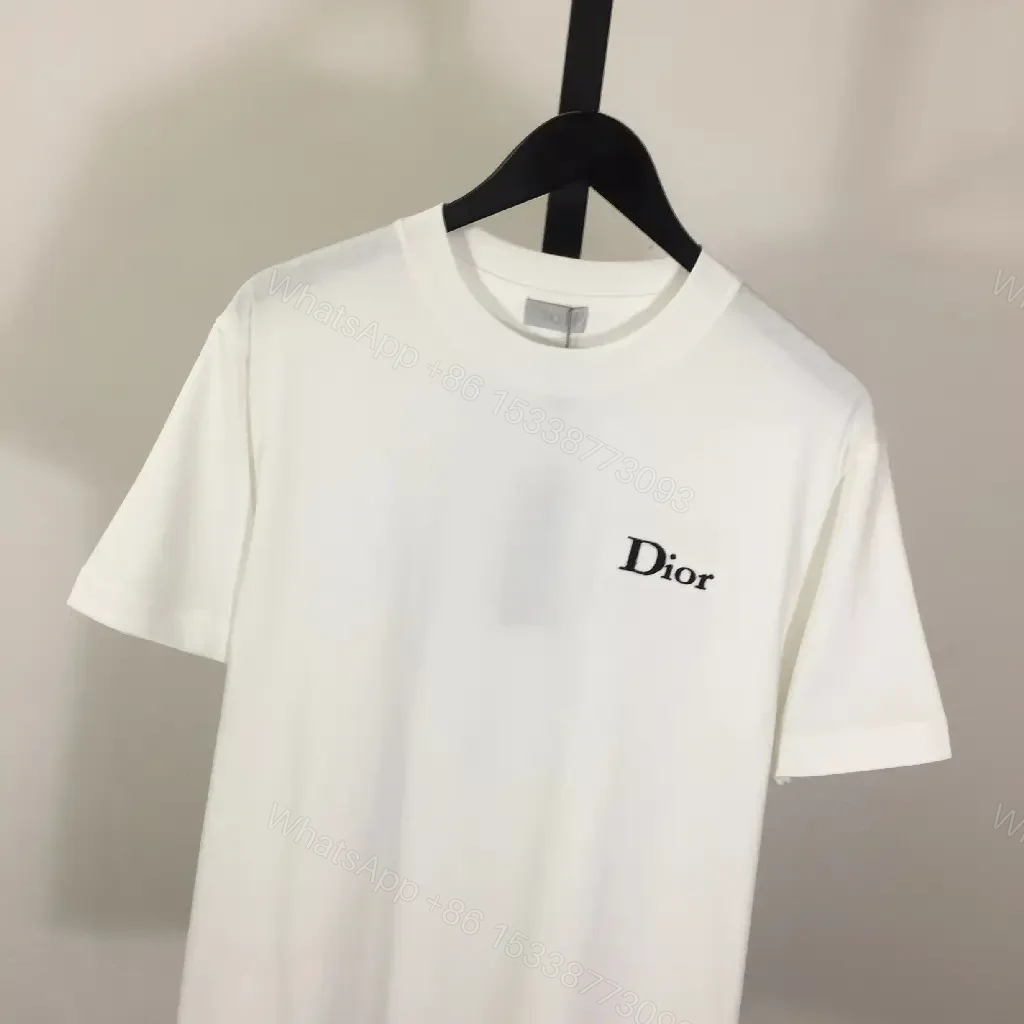 View 7 of Minimalist White Tee: Premium Cotton, Subtle Logo, Classic Fit tee