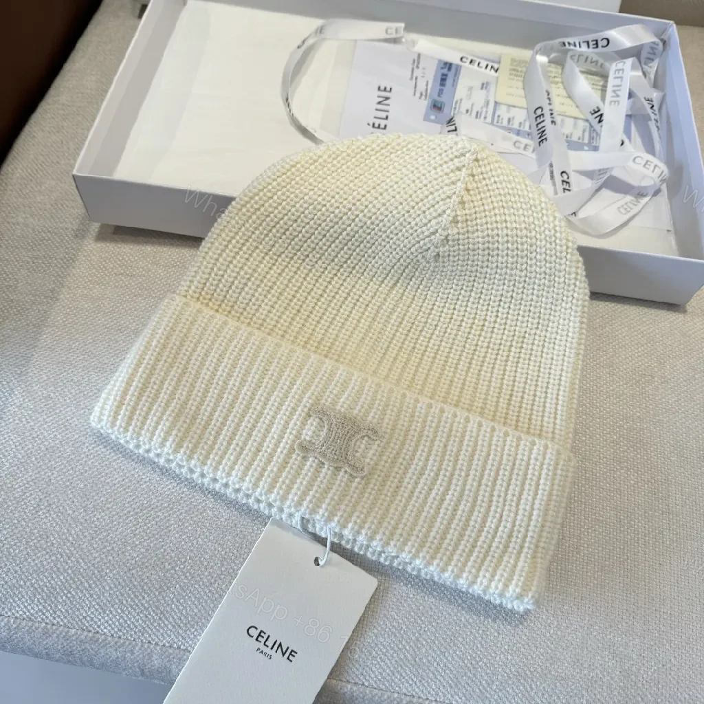 View 3 of Cream Knit Beanie + Ribbed Material + Minimalist Style + Subtle Monogram + Beanie