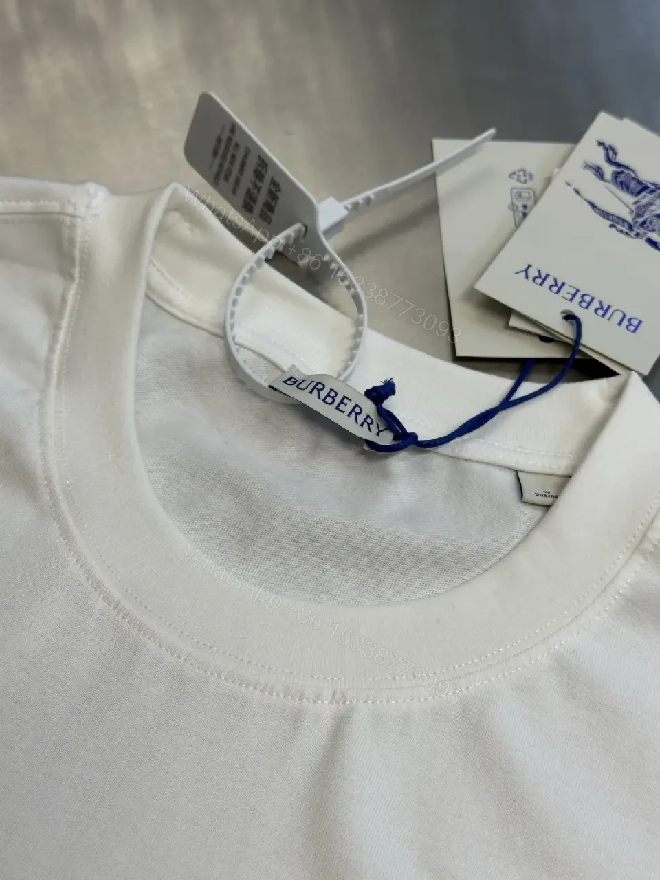 View 6 of Minimalist Burberry-Style White Cotton Tee: Elevated Everyday Comfort