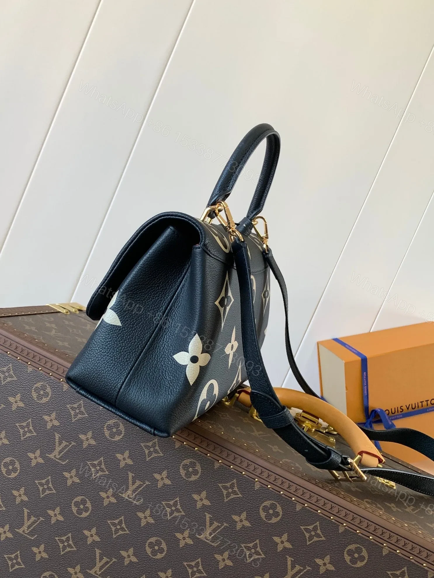 View 2 of LV MADELEINE 30 IN BLACK MIX WHITE MONOGRAM CALFSKIN EMBOSSED LOGO