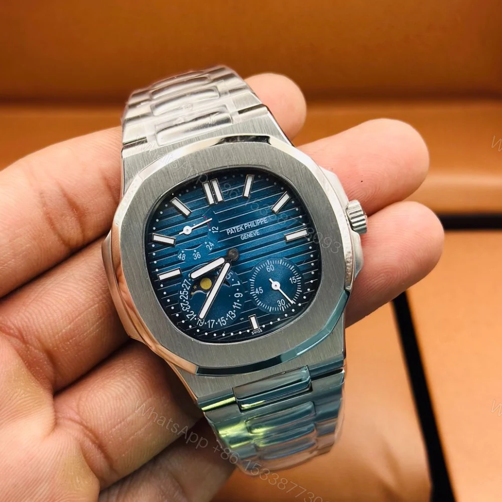 View 2 of Patek Philippe Nautilus Moon Phase Blue Striped Dial Steel