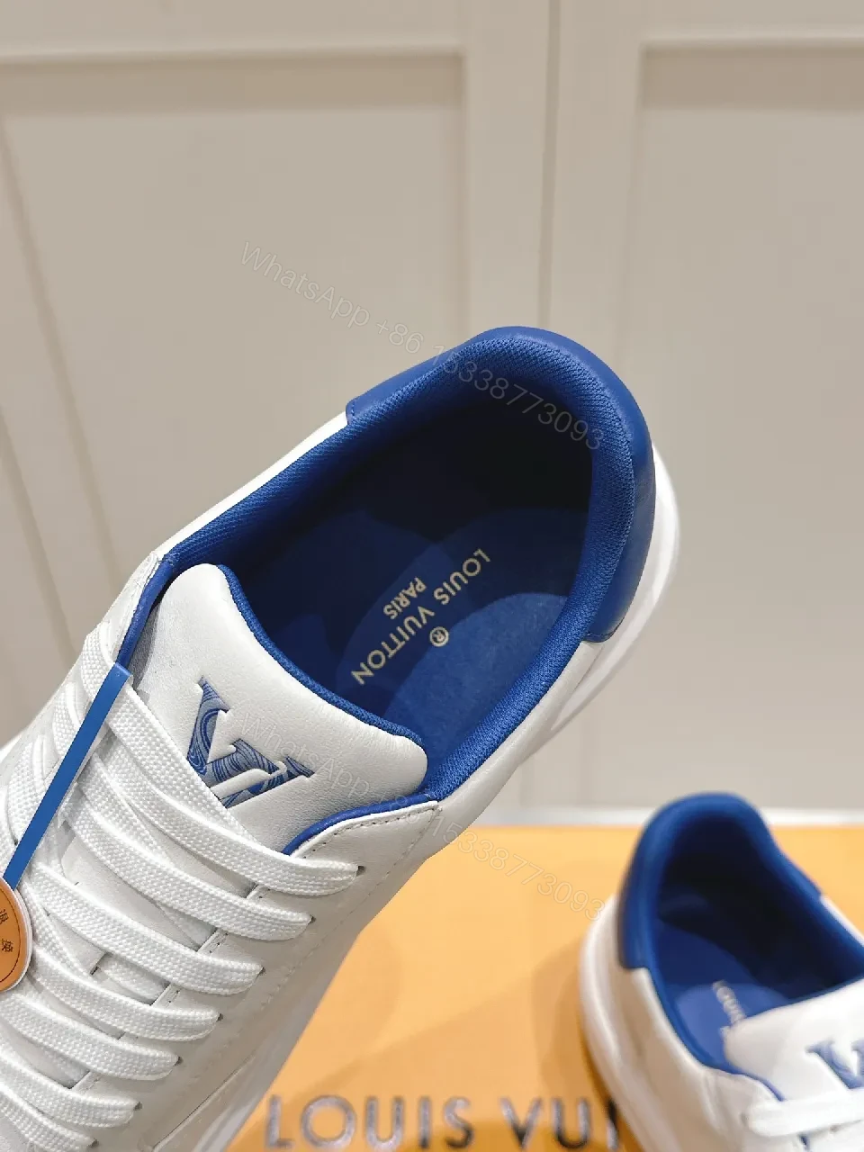 View 6 of Clean White Leather Low-Top Sneakers with Subtle Designer Embellishments