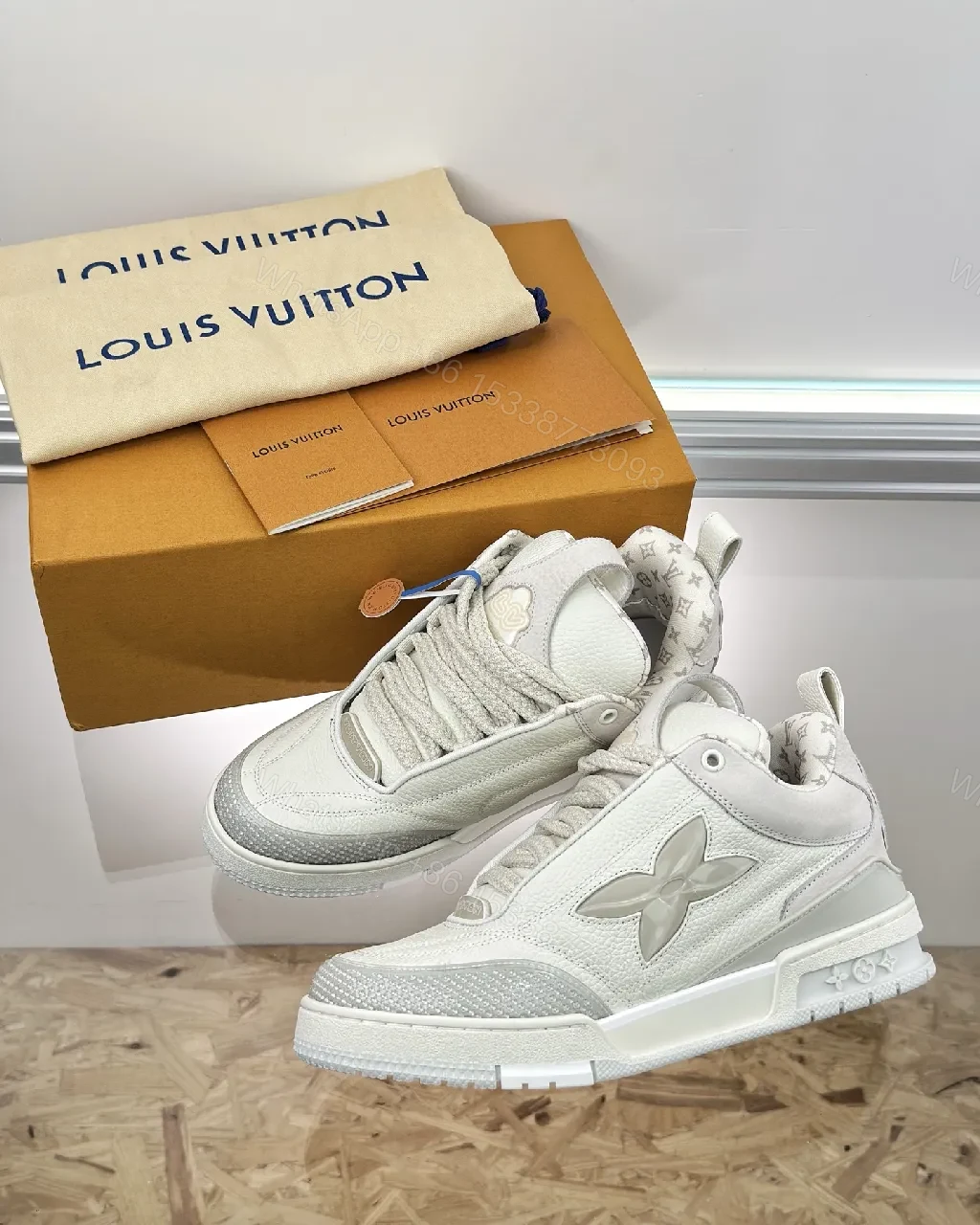 Textured White Leather Sneakers with Signature Motif, Modern Luxury — view 1