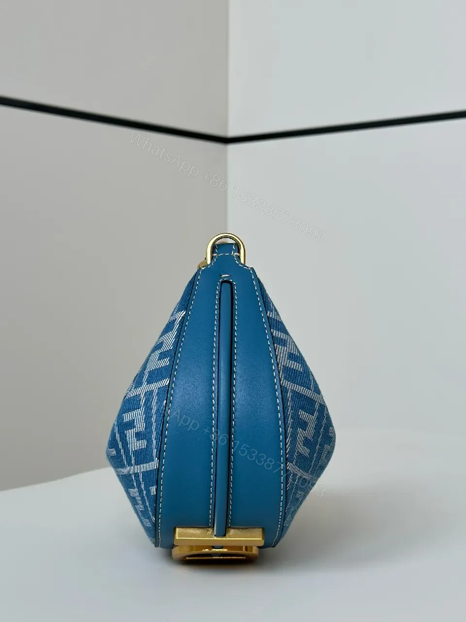 View 2 of Blue Monogram Hinge Bag in Signature Pattern - Everyday Luxury Bag