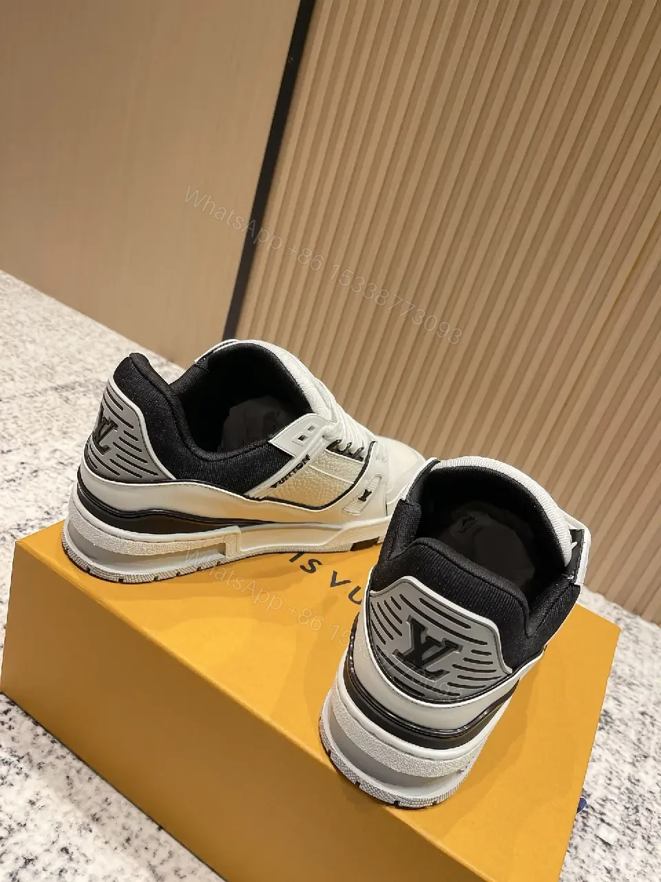 View 2 of White Leather Runner Sneakers with LV Detailing