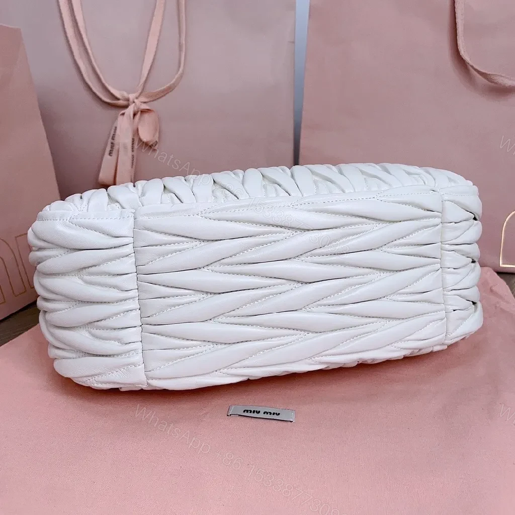 View 7 of Pearl White Quilted Handbag – Soft Gold Logo, Elegant Wave Stitching