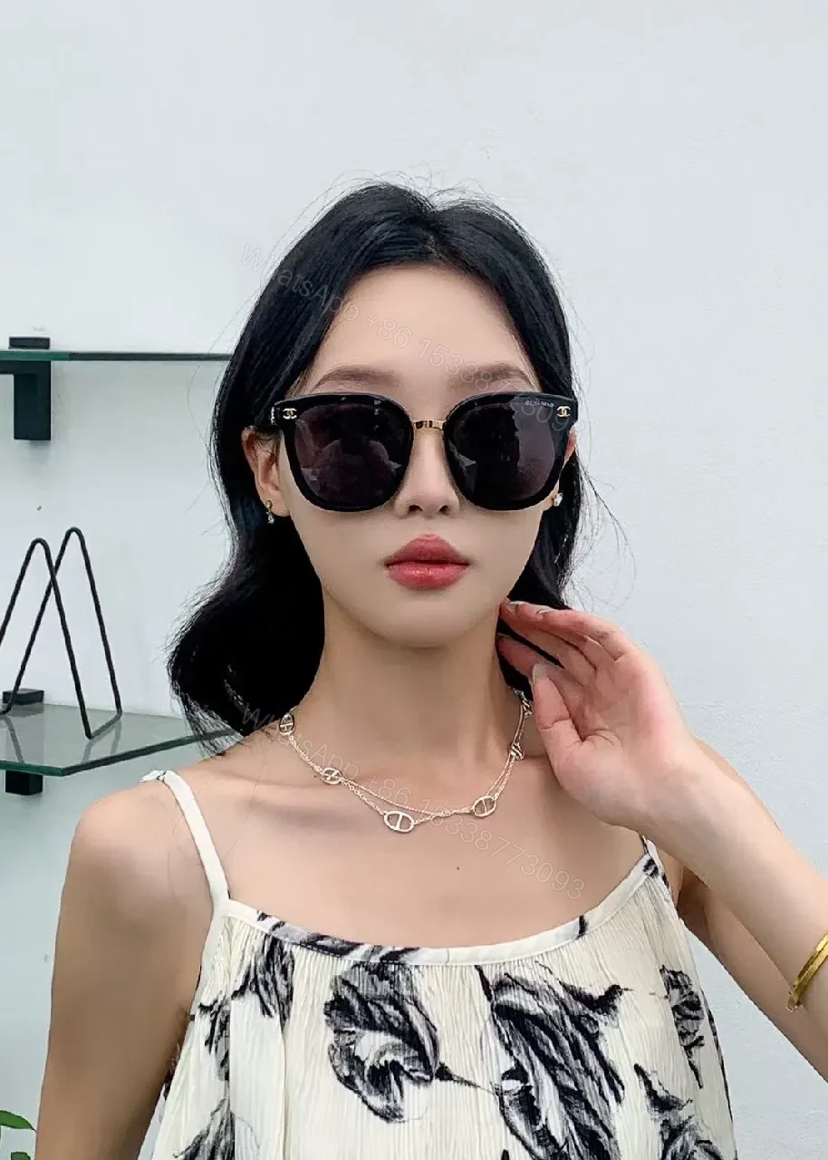 View 4 of Glossy Black Cat-Eye Sunglasses with Gold Accents & Red Temples