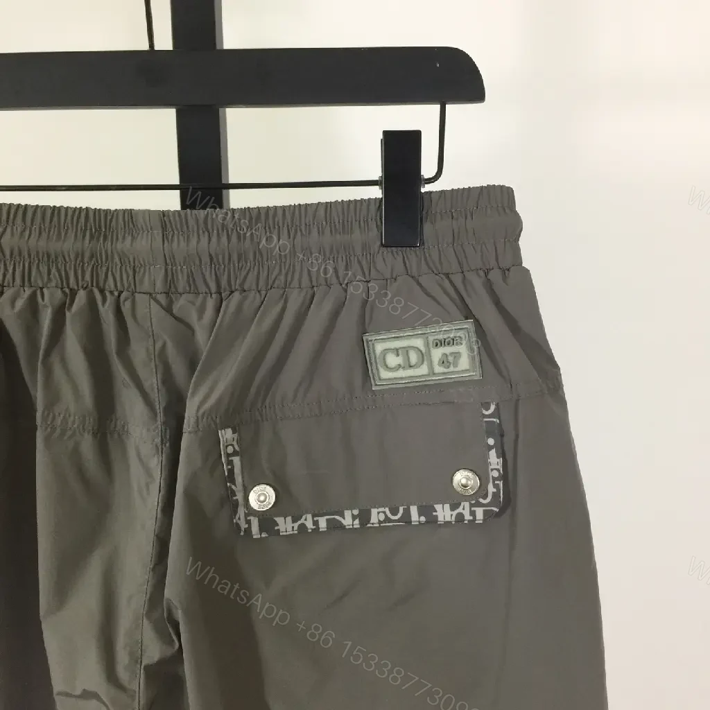 View 2 of Gray Nylon Bermuda Shorts Dior Logo Clip Hem Trim