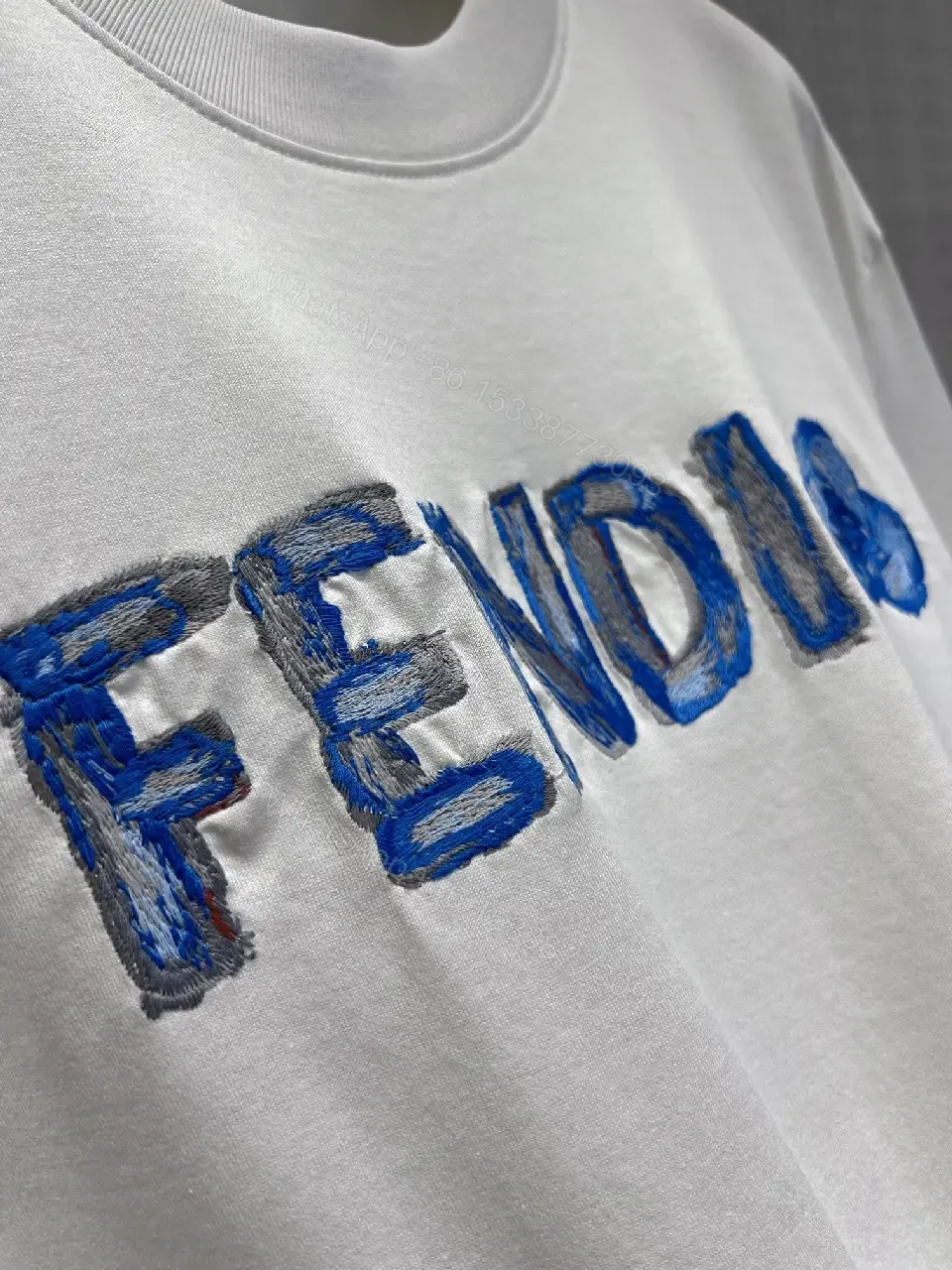 View 10 of Minimalist White Tee with Luxe Embroidered Logo, Casual-Ready Top