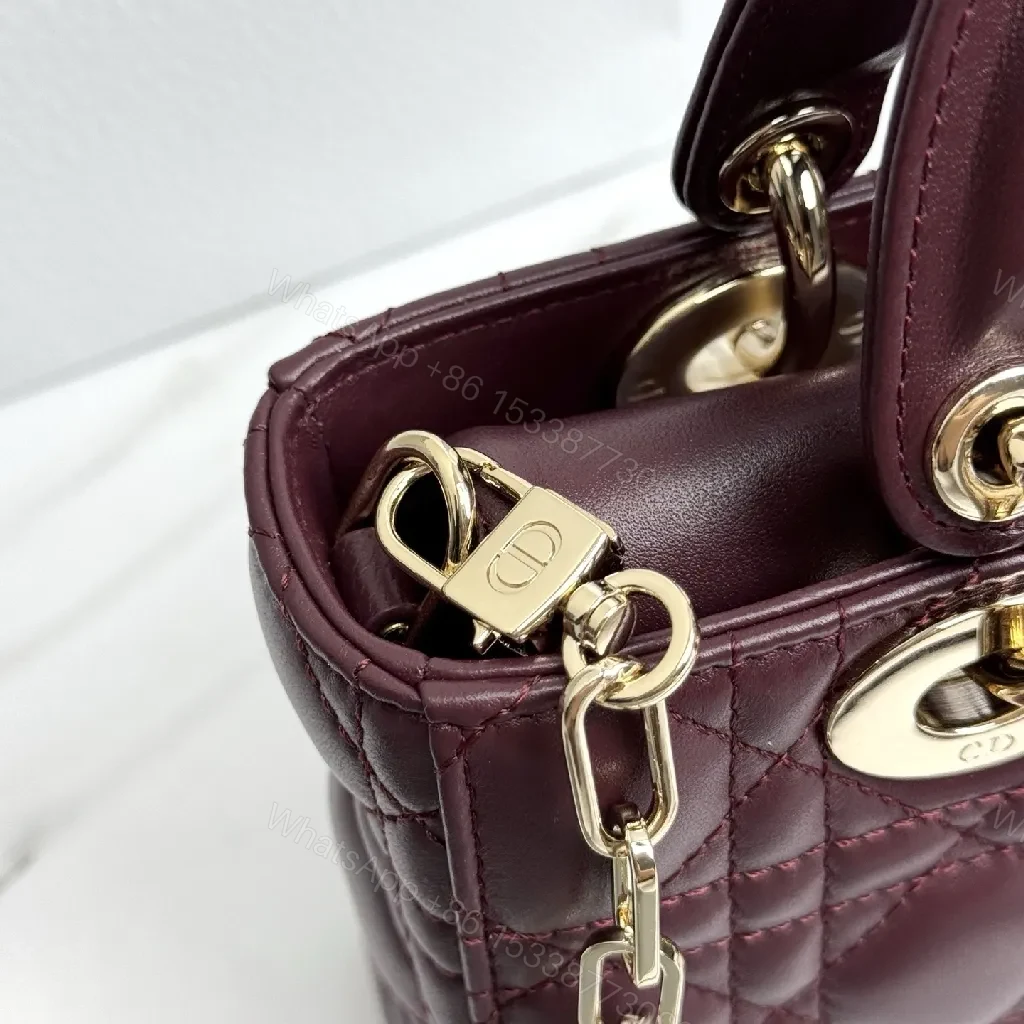 View 5 of Quilted Burgundy Calfskin Top-Handle Bag with Gold Accents