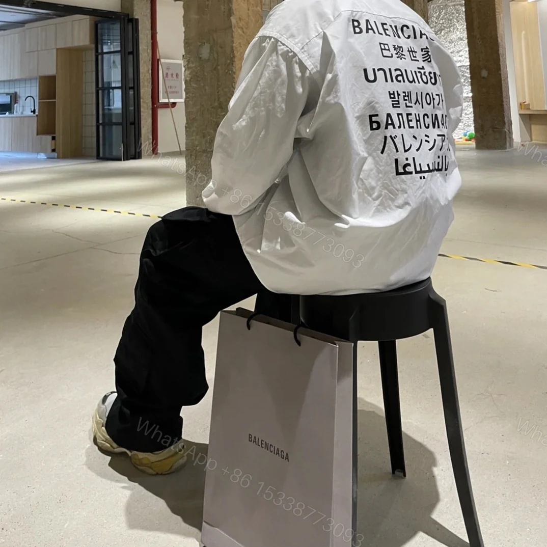 View 15 of 高仿Balenciaga*SS24系列647357七國語言襯衫白色