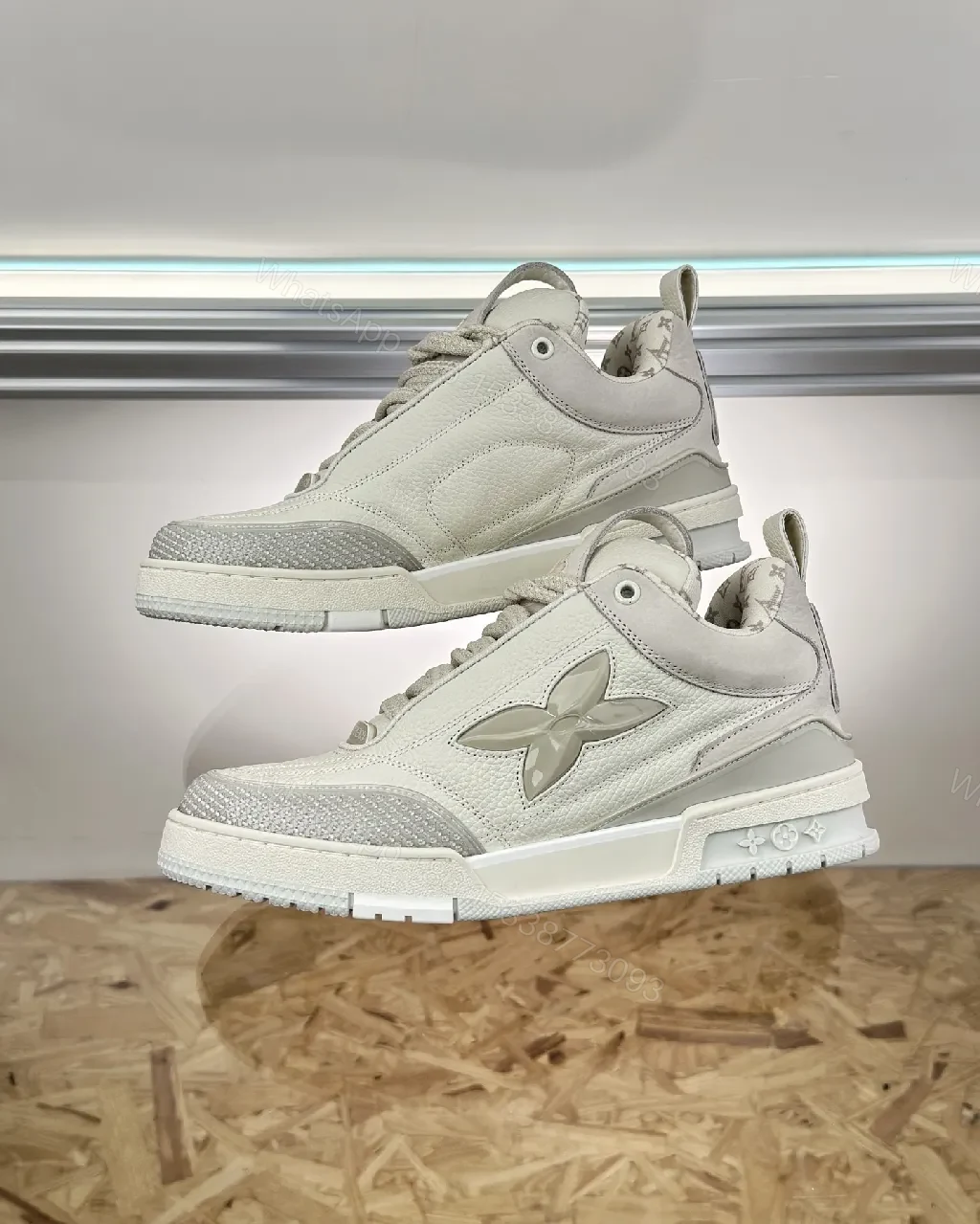 View 9 of Textured White Leather Sneakers with Signature Motif, Modern Luxury