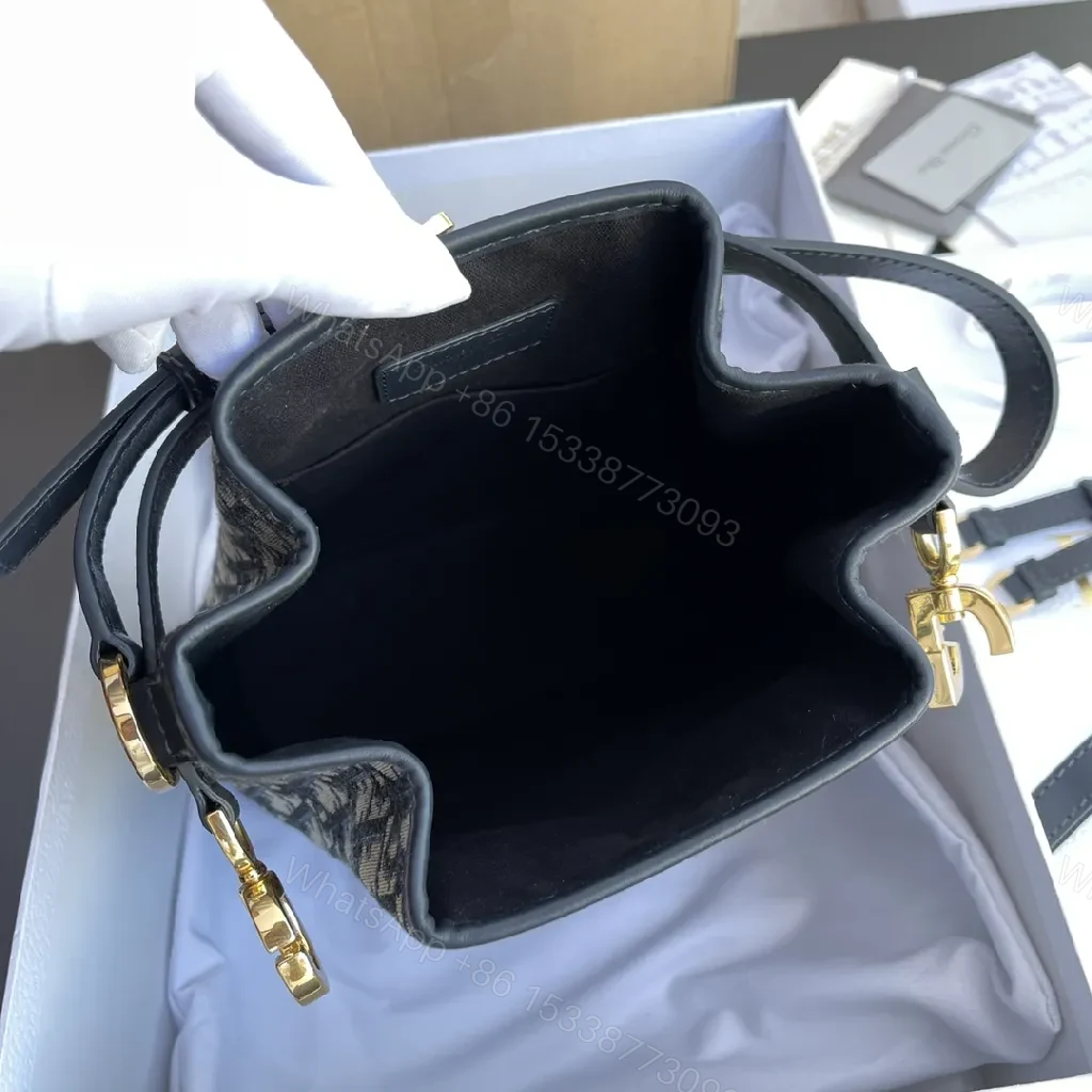 View 6 of Structured Classic Monogram Canvas Bucket Bag with Gold Hardware