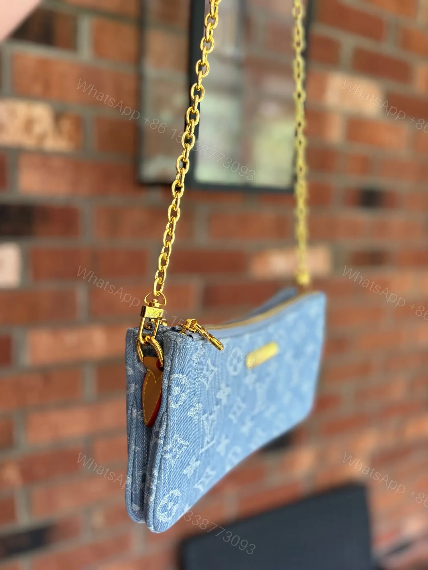View 2 of Louis Vuitton Liv Pochette in Blue Denim